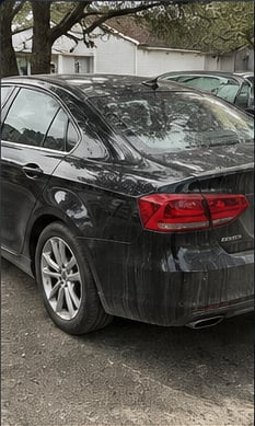 Sedan exterior before detailing, dulled and dusty finish